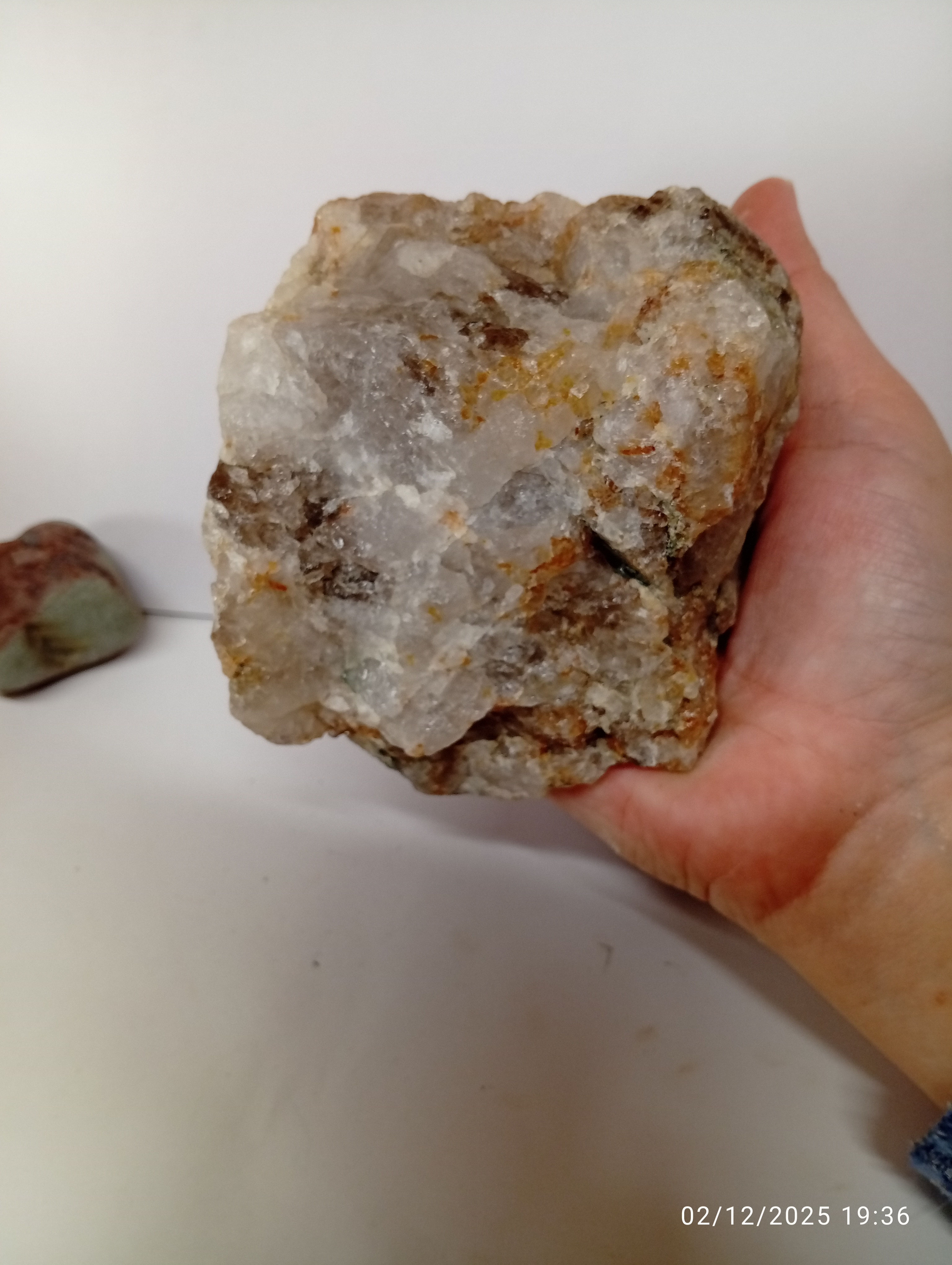 A large chunk of Scottish smoky quartz with yellow iron oxide staining.