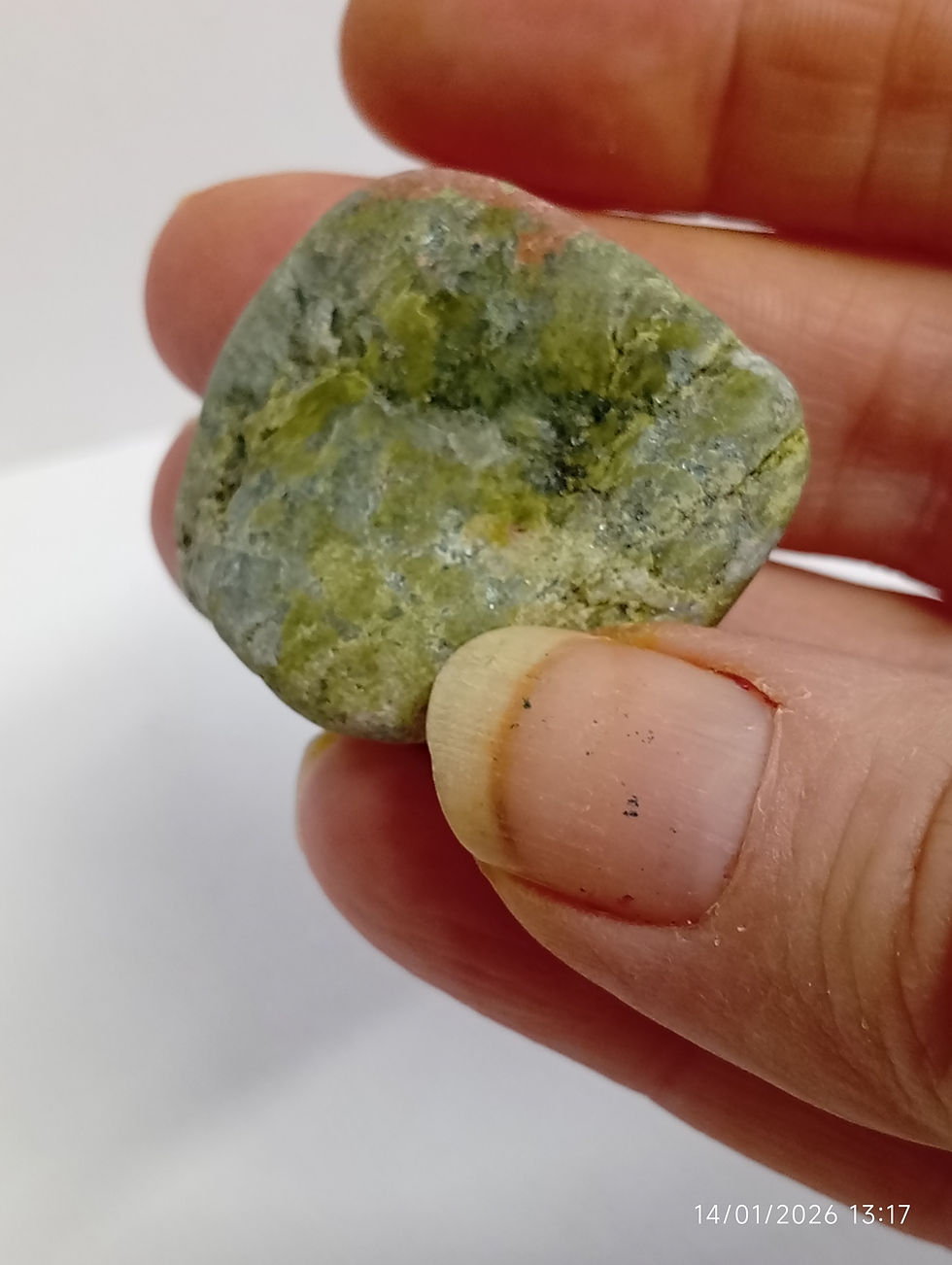 a pink feldspar and green epidoite rock