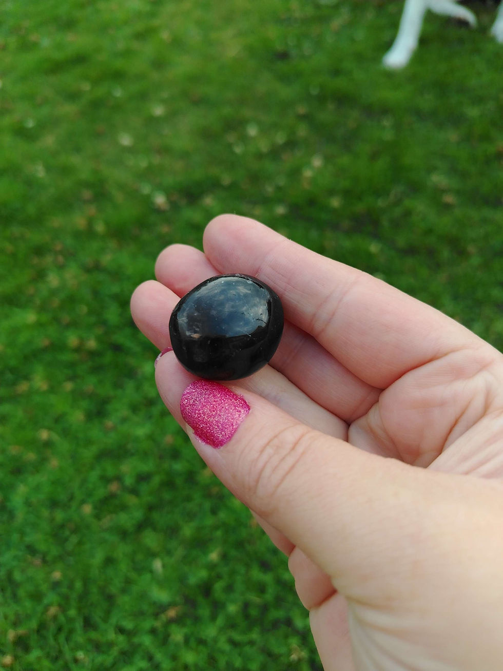 a dark black smoky quartz tumbled stone