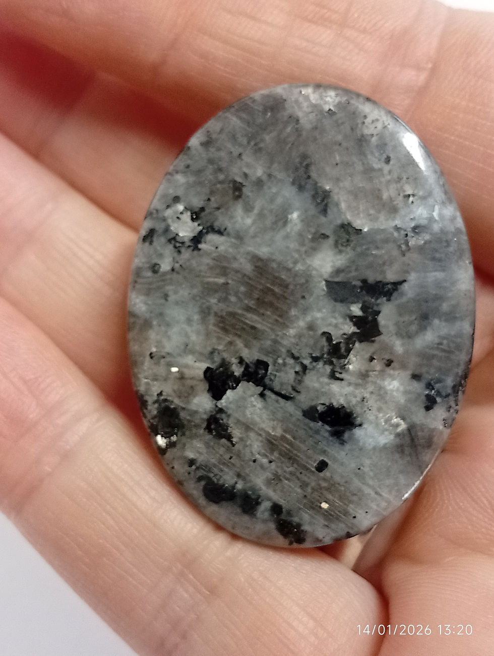 a light grey labradorite palm stone