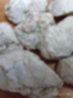 a Close up of layered barite crystals in milky white