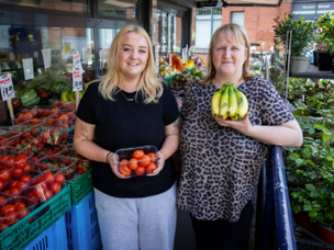photo of two stall holders in Ashton Market place