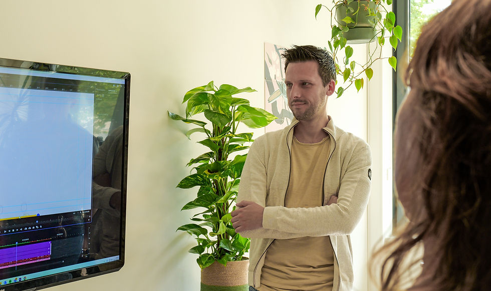 Man looking at screen with instructional video