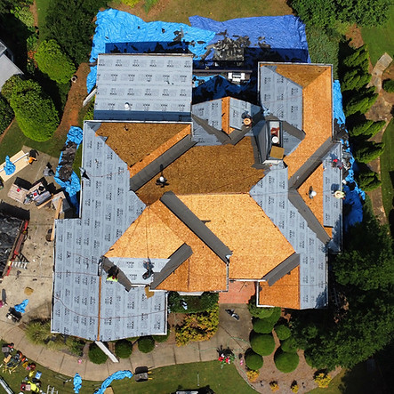 Aerial view of new roof installation on residential home