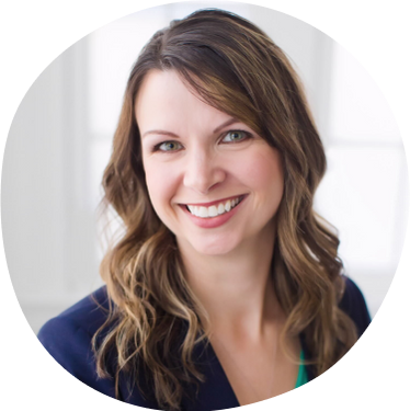 Caytie Bowser, Board Member, smiling and wearing a navy blazer
