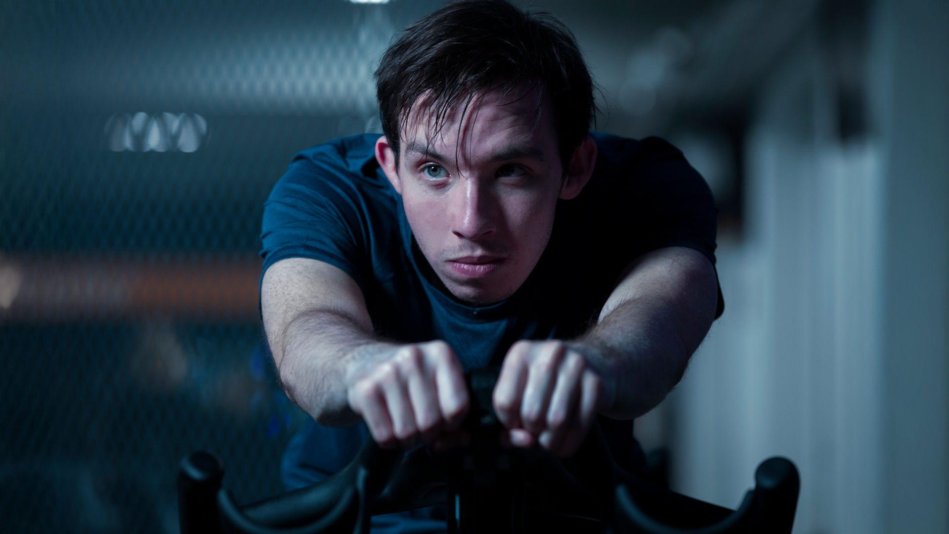 a man on an exercise bike in a Pure Gym