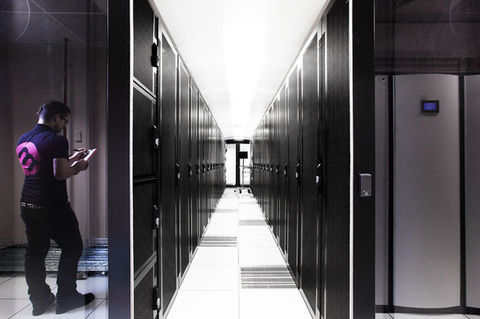 a row of servers in a server room