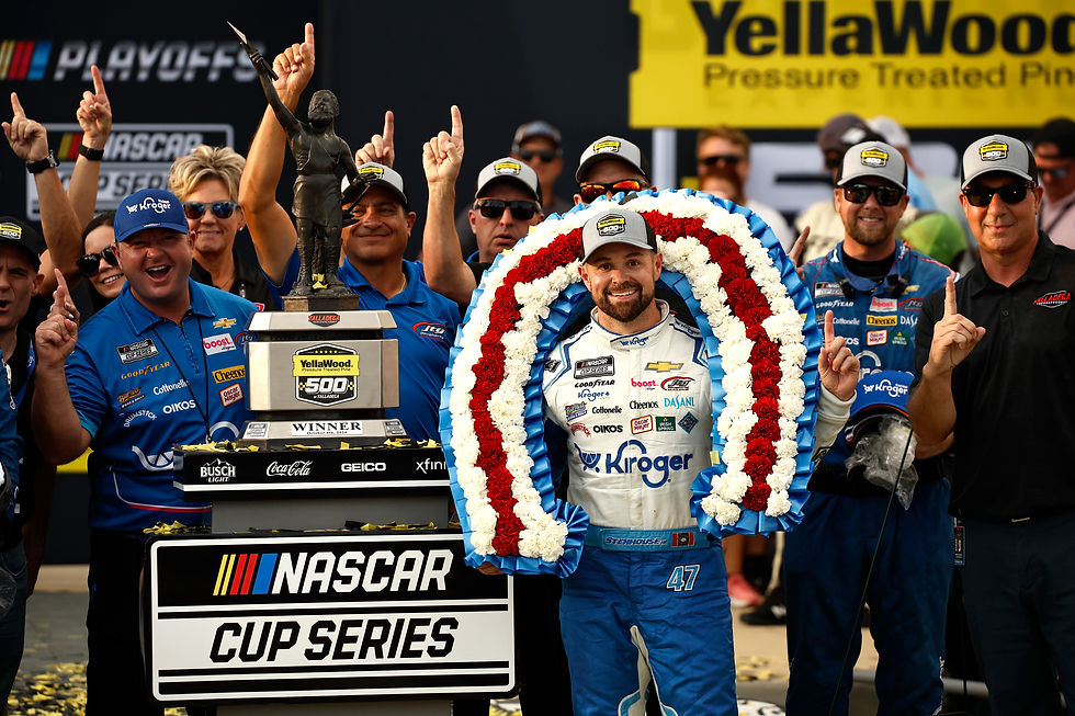 Ricky Stenhouse Jr. with his trophy after winning the YellaWood 500 at Talladega last season - Photo by Chris Graythen