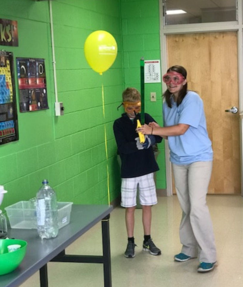 Hydrogen balloon and birthday candle.