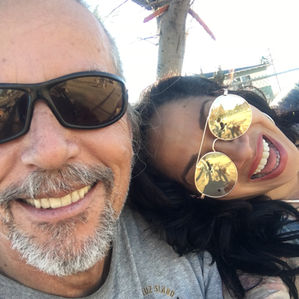 Kai and co-founder Valerie are captured in a playful and joyful moment together.
