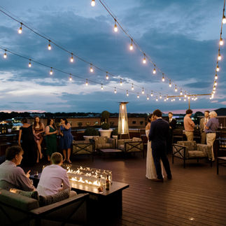 bride and groom dancing at wedding on the rooftop