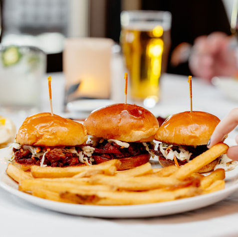 Plate of three mini pulled pork sliders