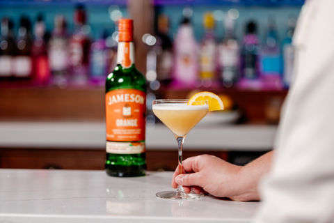 Cocktail and Jameson orange bottle.