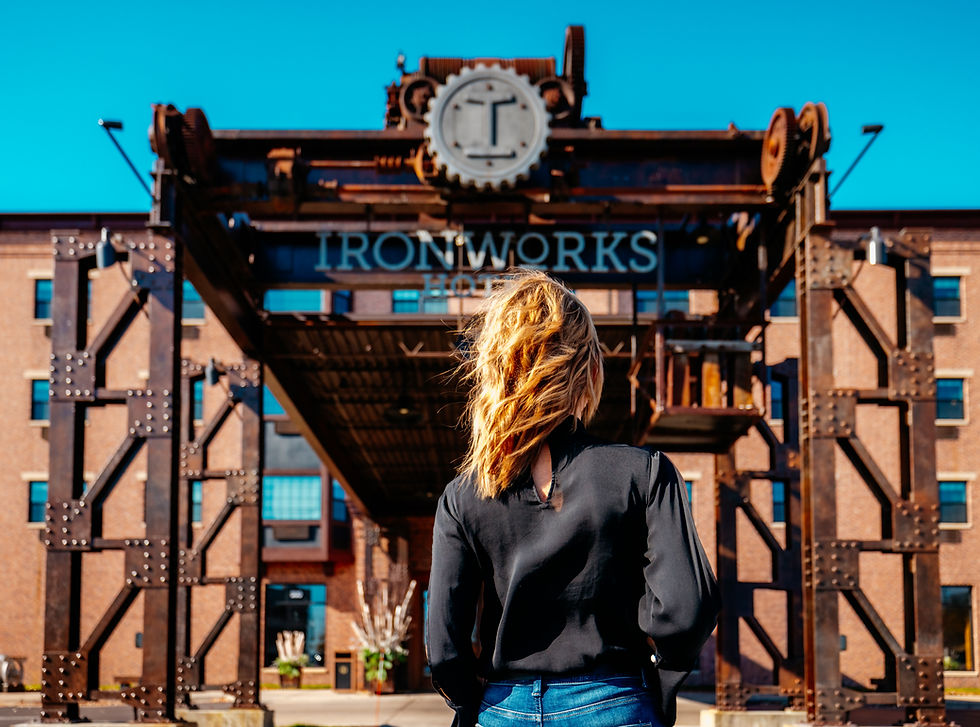 woman standing outside of Ironworks Hotel