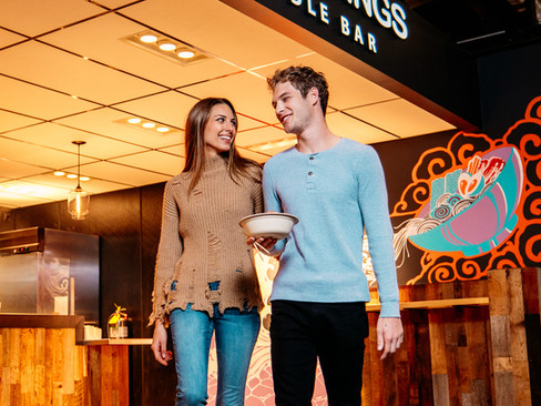 A couple enjoying Date Night at The Garage Food Hall