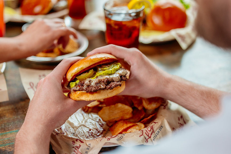 person holding a burger