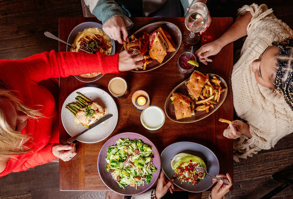 four women sitting around table dining