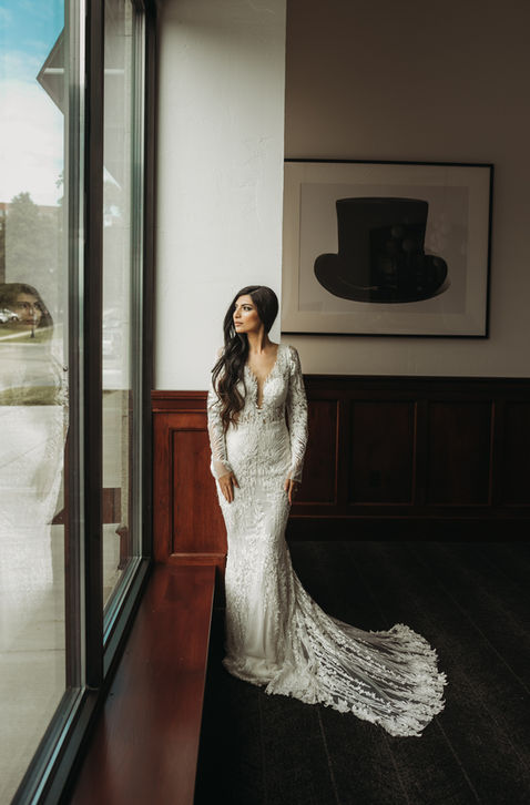 Bride standing in state room at Hotel Goodwin