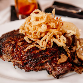 Ribeye with fried onions on top