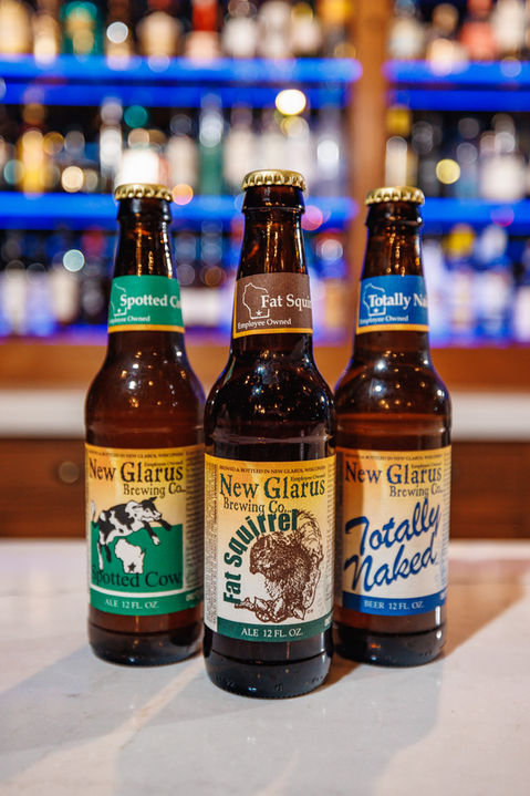 Three bottles of New Glarus beers