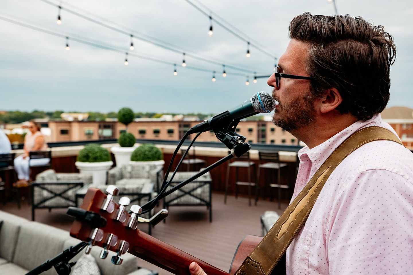 man singing with guitar