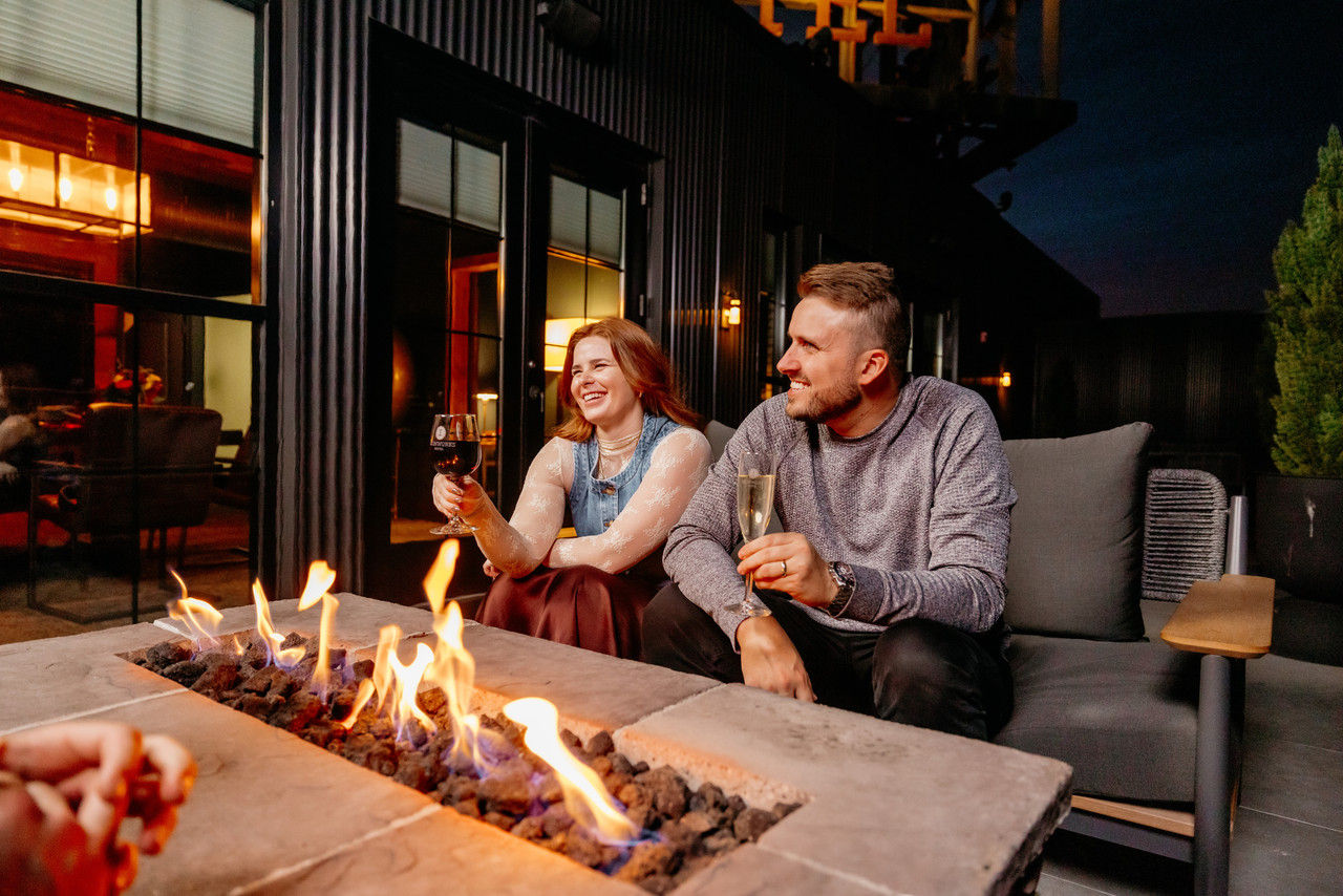 Laughing around a fire on the terrace
