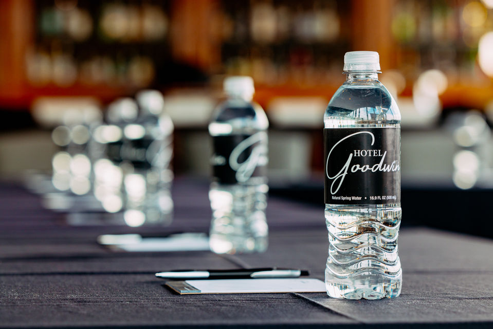 Water bottles and notepads setup on a table for a meeting