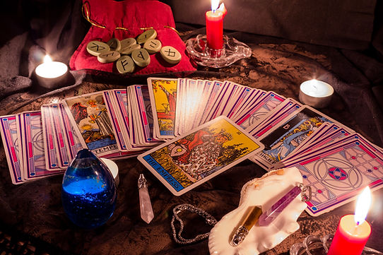 Tarot cards by candlelight in the evening.jpg