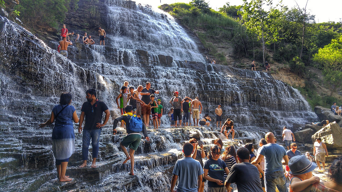 People standing along the waterfalls