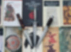 Three blades lying on top of philosophy books
