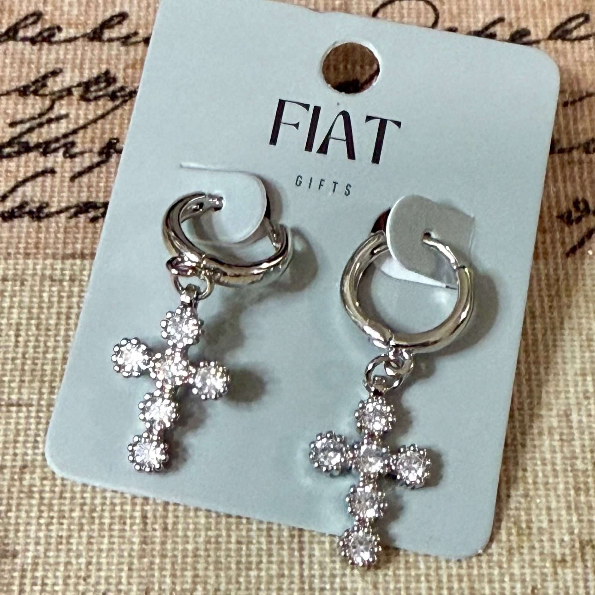 Gold plated, silver color cross earrings.