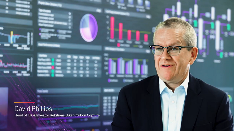 Man in front of computer screens showing digital data
