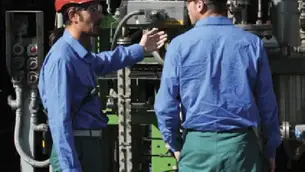 two plant operators chatting