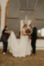 Dallas wedding photographer capturing a candid moment of a bride and groom outside a church after their wedding ceremony