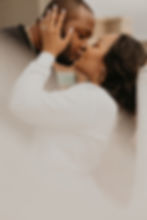 Chanel and Desmond engagement session captured in downtown Dallas by SHOTS BY LC, showcasing an intimate kiss and romantic connection before their 2023 wedding