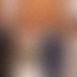 Family portraits after wedding ceremony featuring the bride and groom with parents inside a church