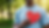 man holding a cut out of a red heart in front of his chest