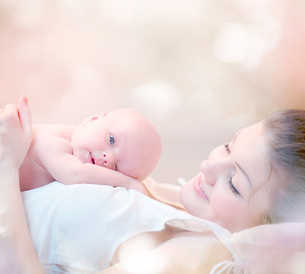 Mother and her Newborn Baby. Happy Mothe