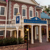 Image of the outside of the Hall of Presidents in Liberty Square, Magic Kingdom. Colonial buildings.