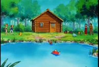 People stand by a lake near a wooden cabin in a green forest; one child floats in the water.