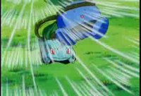 Blue creature is struck by a green attack in a grassy scene, with speed lines and a tense action feel.