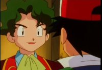 Anime boy in red and green smiles at a person in a red hat indoors, with a warm, friendly mood.