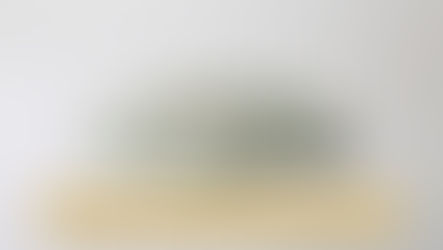 A stack of US twenty-dollar bills on a white background, neatly arranged, with visible serial numbers and historical figure portraits. With an overlay text "Understanding Passive Activity Loss Rules: How Depreciation and Cost Recovery Impact Your Taxes"