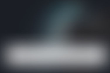 Hand writing on a digital tablet in a dimly lit room. Text reads "How to Use Trusts for Legal Asset Protection and Tax-Efficient Inheritance."