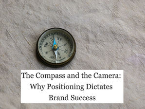 Vintage compass on beige fabric with text reading The Compass and the Camera: Why Positioning Dictates Brand Success