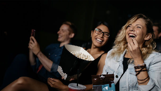 A group of people enjoying a film at the cinema