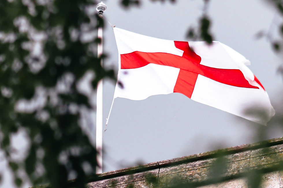 An English flag blowing in the wind.