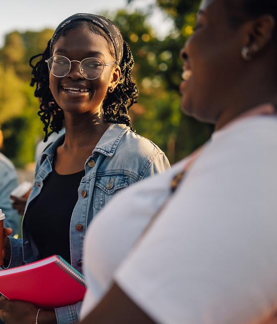 diverse-college-girl-walking-at-campus-and-smiling-2026-01-09-10-26-49-utc.jpg