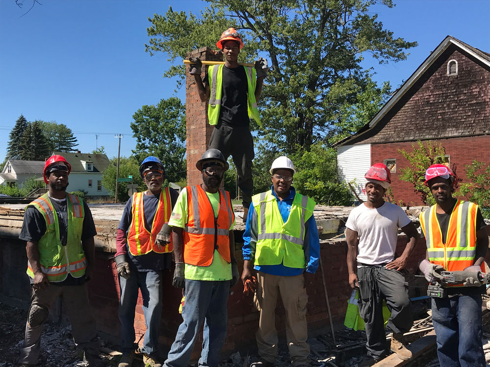 We Want Green Too crew on a Detroit home