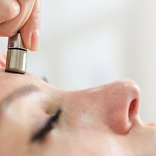 Microdermabrasion tool being used in skin care treatment